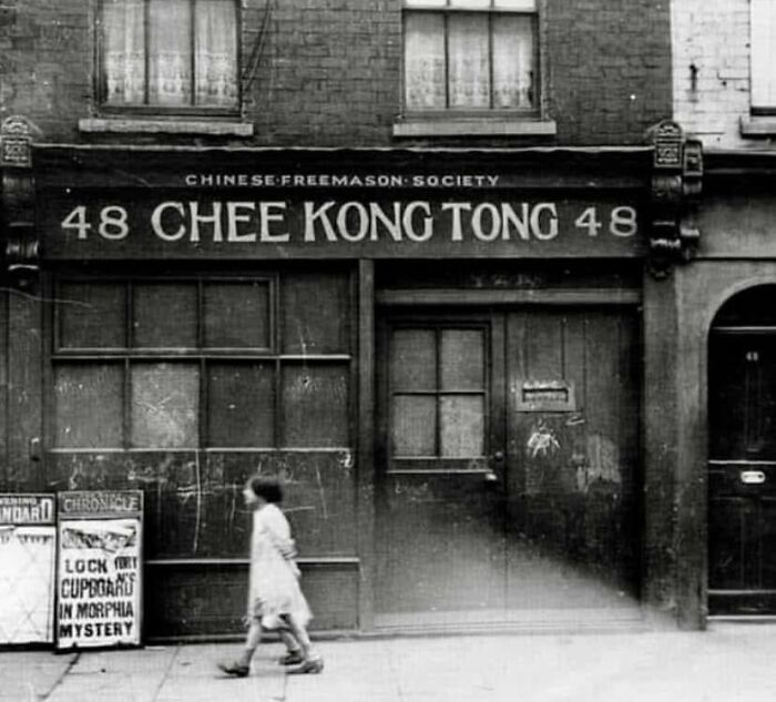 Rare historical photo of Chinese Freemason Society building with two children walking by