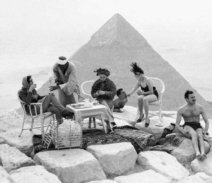 Rare historical photo of group enjoying tea picnic near Egyptian pyramids