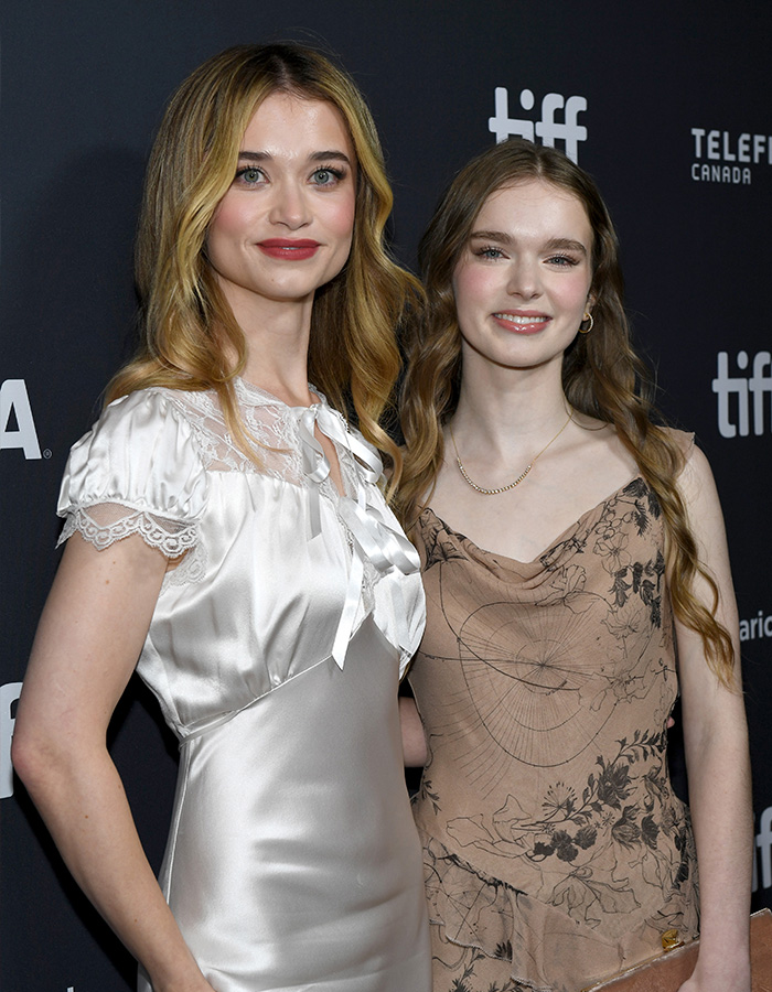 Two actresses smile on the red carpet, featuring the Hollywood rising star from a Stephen King remake.