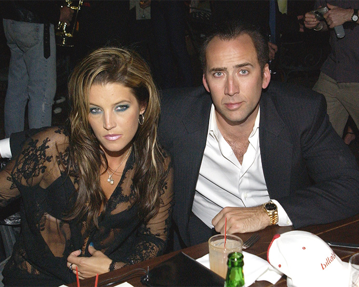 Lisa Marie Presley and Nicolas Cage posing together, related to Michael Jackson and Lisa Marie Presley's marriage