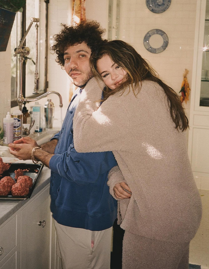 Selena Gomez hugs Benny Blanco from behind as they make meatballs in a cozy kitchen Selena Gomez hugs Benny Blanco from behind as they make meatballs in a cozy kitchen