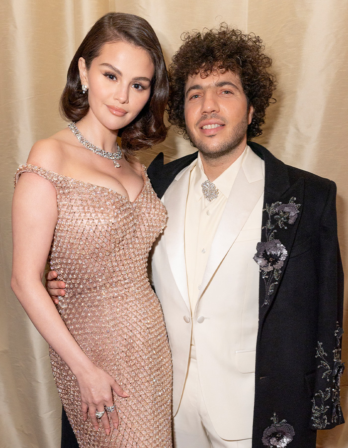 Selena Gomez and Benny Blanco posing together in formal attire at an elegant event Selena Gomez and Benny Blanco posing together in formal attire at an elegant event