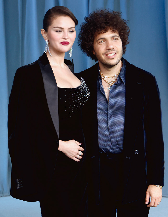 Selena Gomez and Benny Blanco posing together in stylish dark suits Selena Gomez and Benny Blanco posing together in stylish dark suits