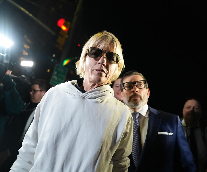 Selma Blair walking at night with sunglasses next to her lawyer following her arrest. Selma Blair walking at night with sunglasses next to her lawyer following her arrest.