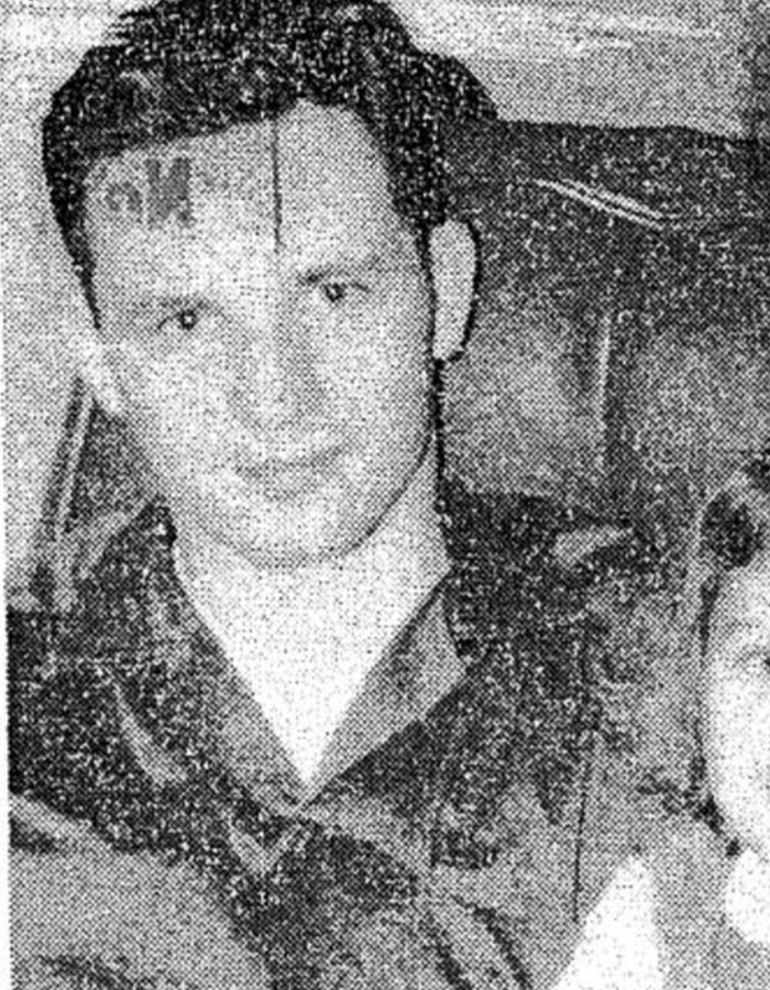 Vintage grainy photo portrait of a man linked to historical cases of serial violent criminals.