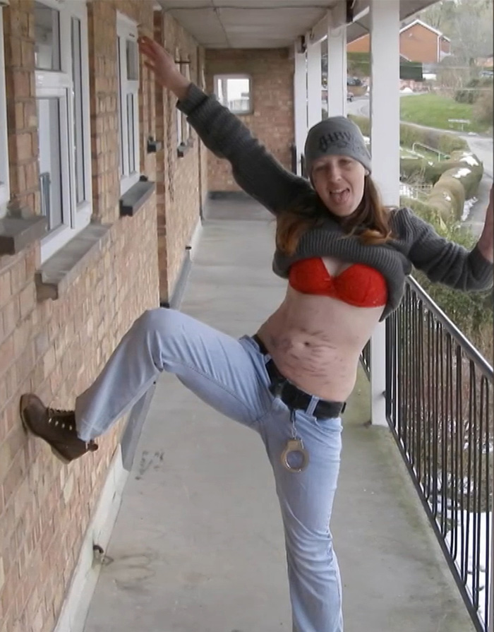 A woman posing playfully outdoors, representing one of several serial violent criminals with a disturbing case history.