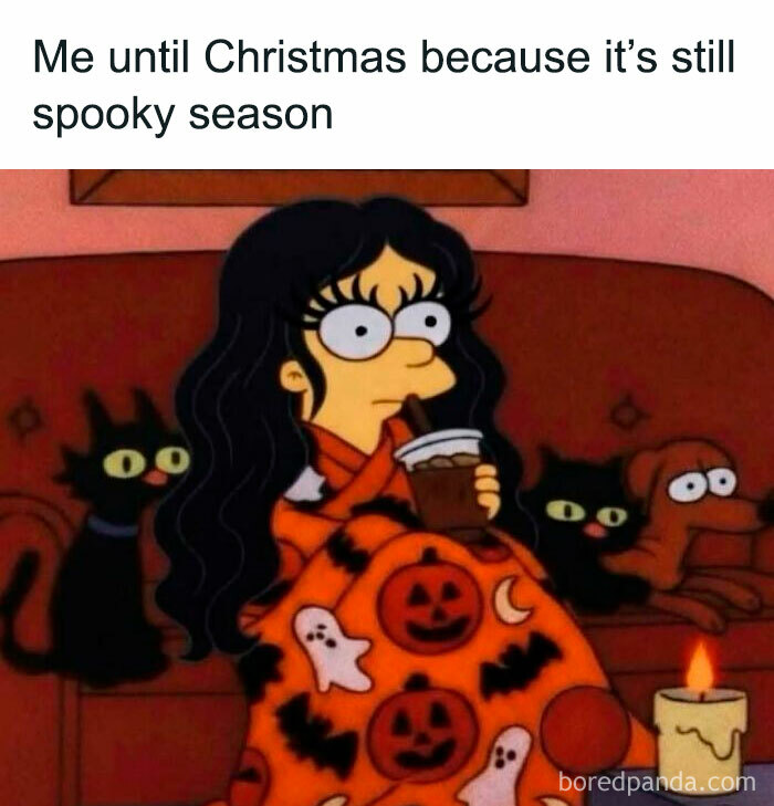 Simpsons character wrapped in a Halloween blanket sitting with cats for spooky season memes