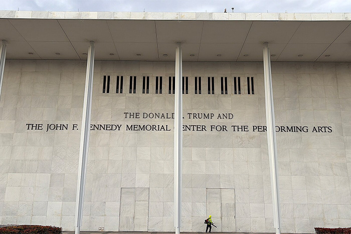 The exterior of a monumental stone building featuring columns and engraved lettering referencing Susan Dell.