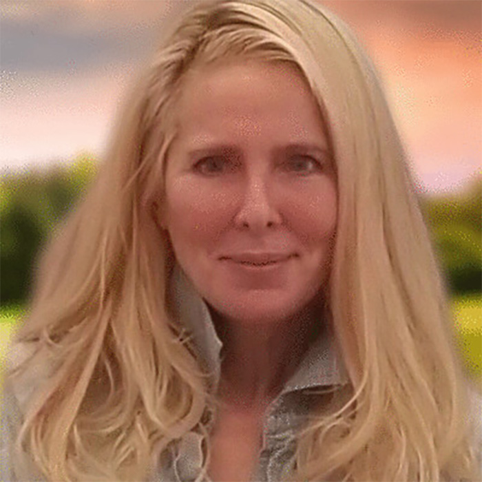 A close-up portrait of Susan Dell smiling during an interview.