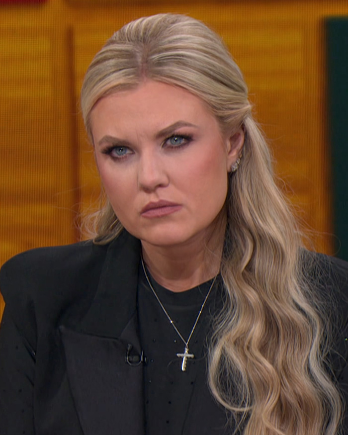 Erika Kirk wearing a black top and cross necklace looking serious amidst an influencer Halloween costume backlash