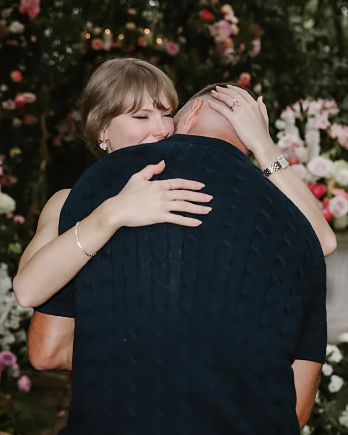 Taylor Swift hugging a man amid flowers, unrelated to Mar-A-Lago face Taylor Swift hugging a man amid flowers, unrelated to Mar-A-Lago face
