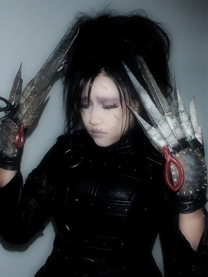 Person in Edward Scissorhands outfit for celebrity Halloween costumes