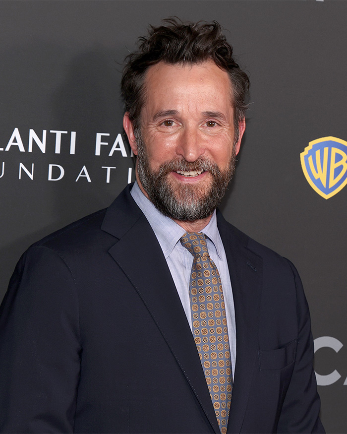 Noah Wyle smiling on the red carpet in a suit, named 2026 Sexiest Man Alive Noah Wyle smiling on the red carpet in a suit, named 2026 Sexiest Man Alive