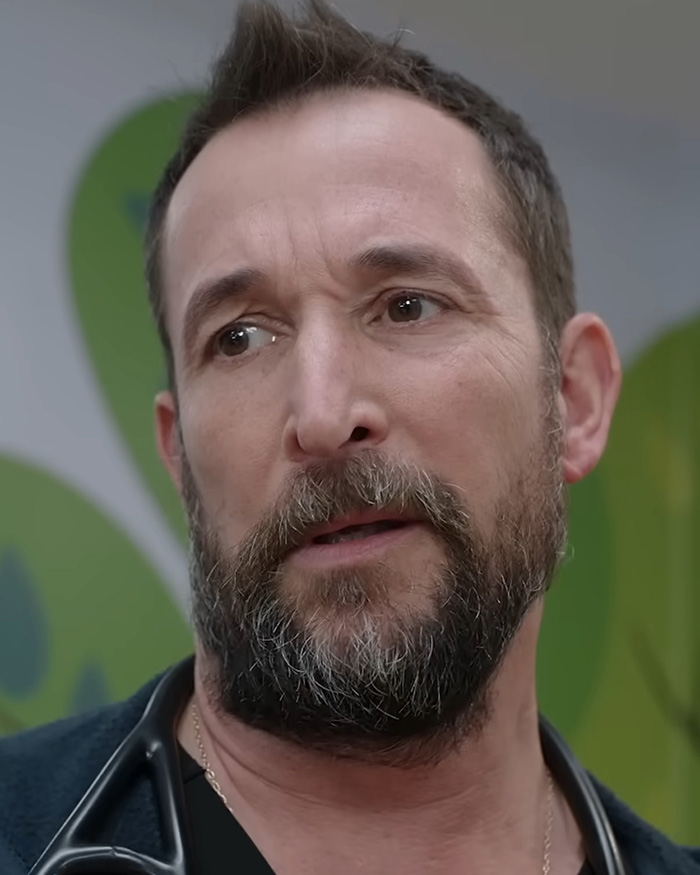 Close-up of Noah Wyle looking serious in medical scrubs for The Pitt Close-up of Noah Wyle looking serious in medical scrubs for The Pitt
