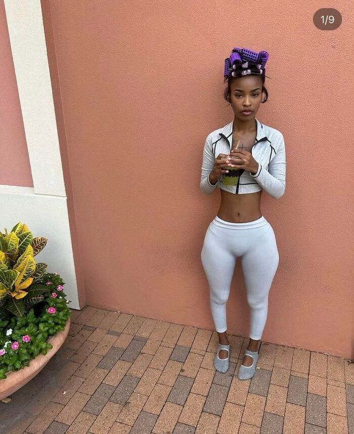 Edited photos with extreme waist slimming and exaggerated hips indoors
