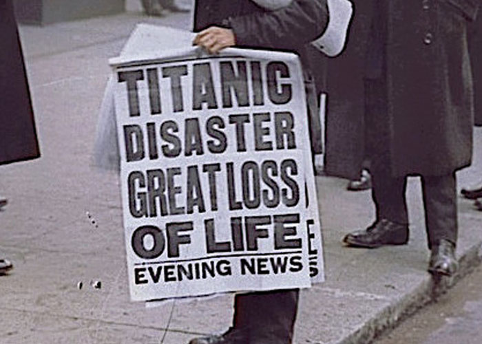 Historic newspaper billboard reporting on the Titanic sank disaster with a huge loss of human life. Historic newspaper billboard reporting on the Titanic sank disaster with a huge loss of human life.