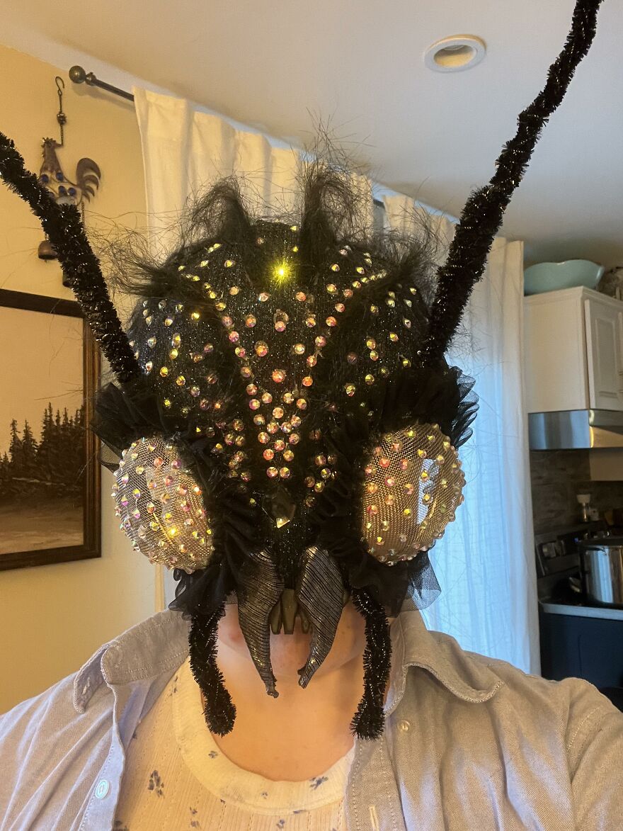 Close up of an elaborate rhinestone insect mask as a creative Halloween costume idea.