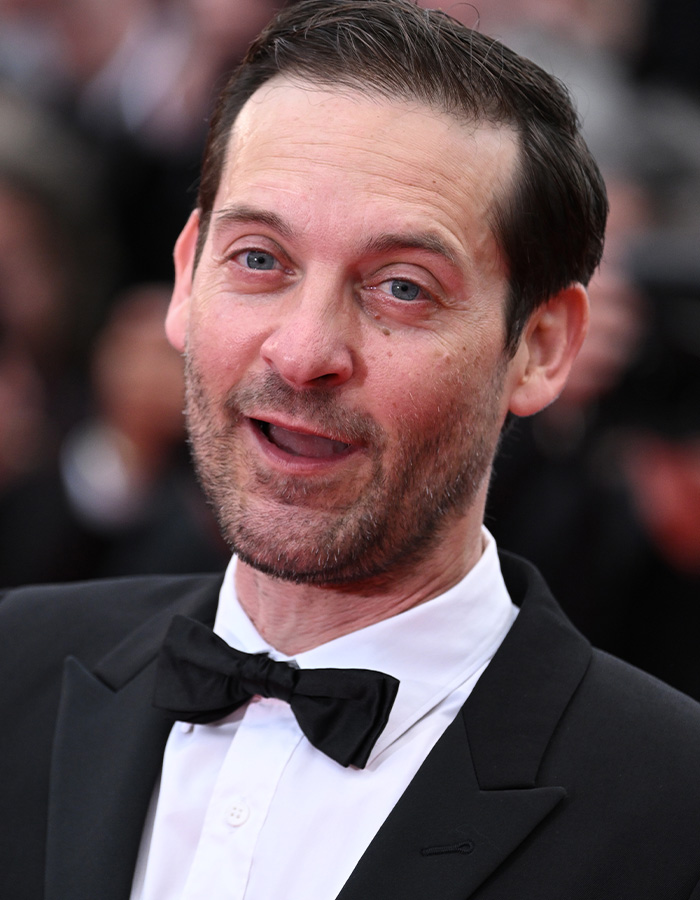 A close-up portrait of actor Tobey Maguire wearing a black tuxedo with a black bow tie A close-up portrait of actor Tobey Maguire wearing a black tuxedo with a black bow tie
