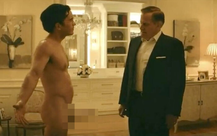 Censored explicit scene featuring two men standing in an ornate room in a Netflix miniseries
