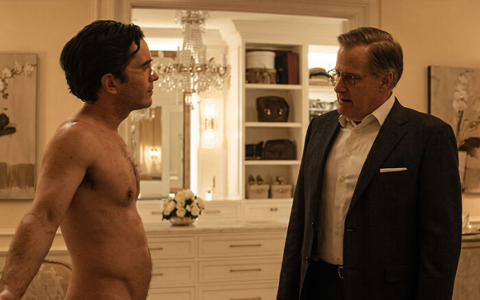Two characters confronting each other in a dramatic Netflix miniseries scene.