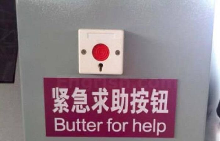 An emergency button featuring translation fails with a sign reading butter for help.
