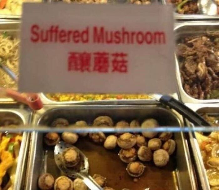 Buffet label example of translation fails reading Suffered Mushroom above cooked mushrooms.