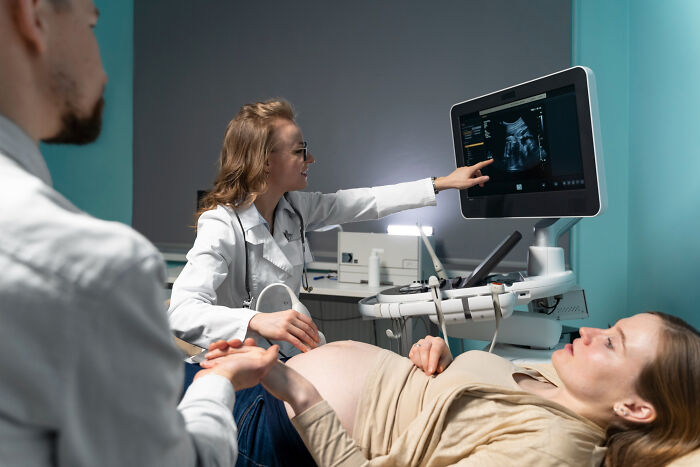 A doctor pointing at an ultrasound screen during an exam, fitting quick-fire jokes.