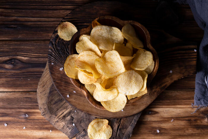 Bowl of crisp potato chips to enjoy while reading quick-fire jokes.