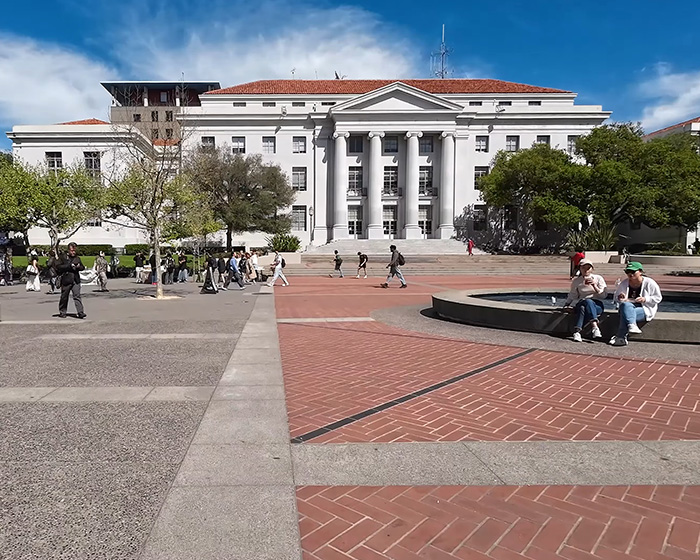 Spraul plaza with students at UC Berkeley university campus on a sunny day.