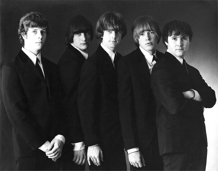 Vintage black and white photo of a five-member classic rock band sharing true stories.