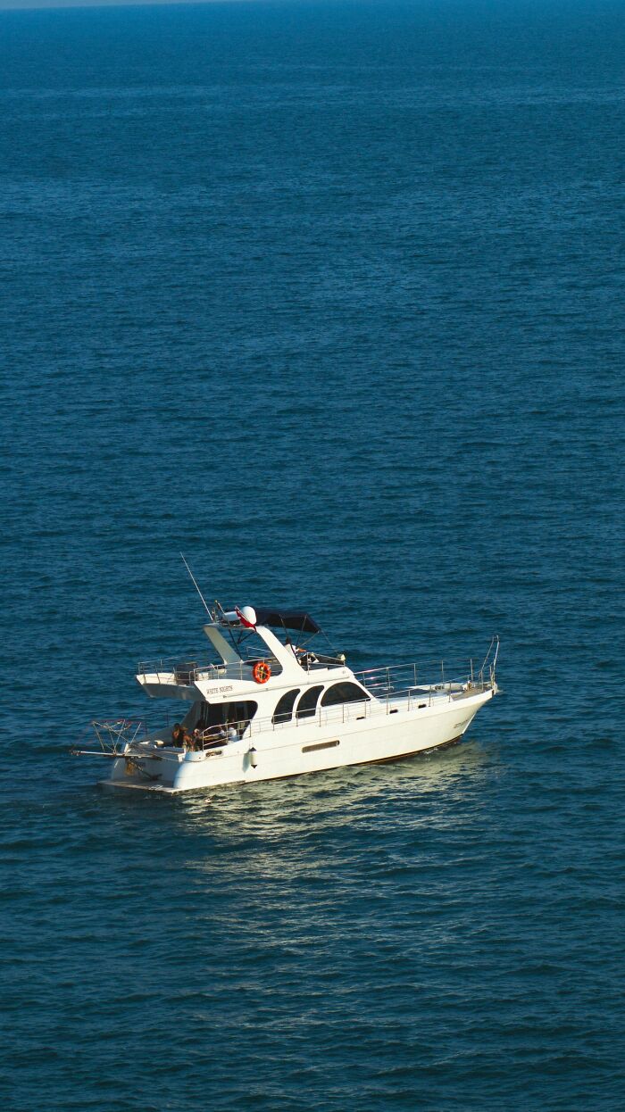 A white yacht sailing on the open ocean, an setting for unbelievable true stories.