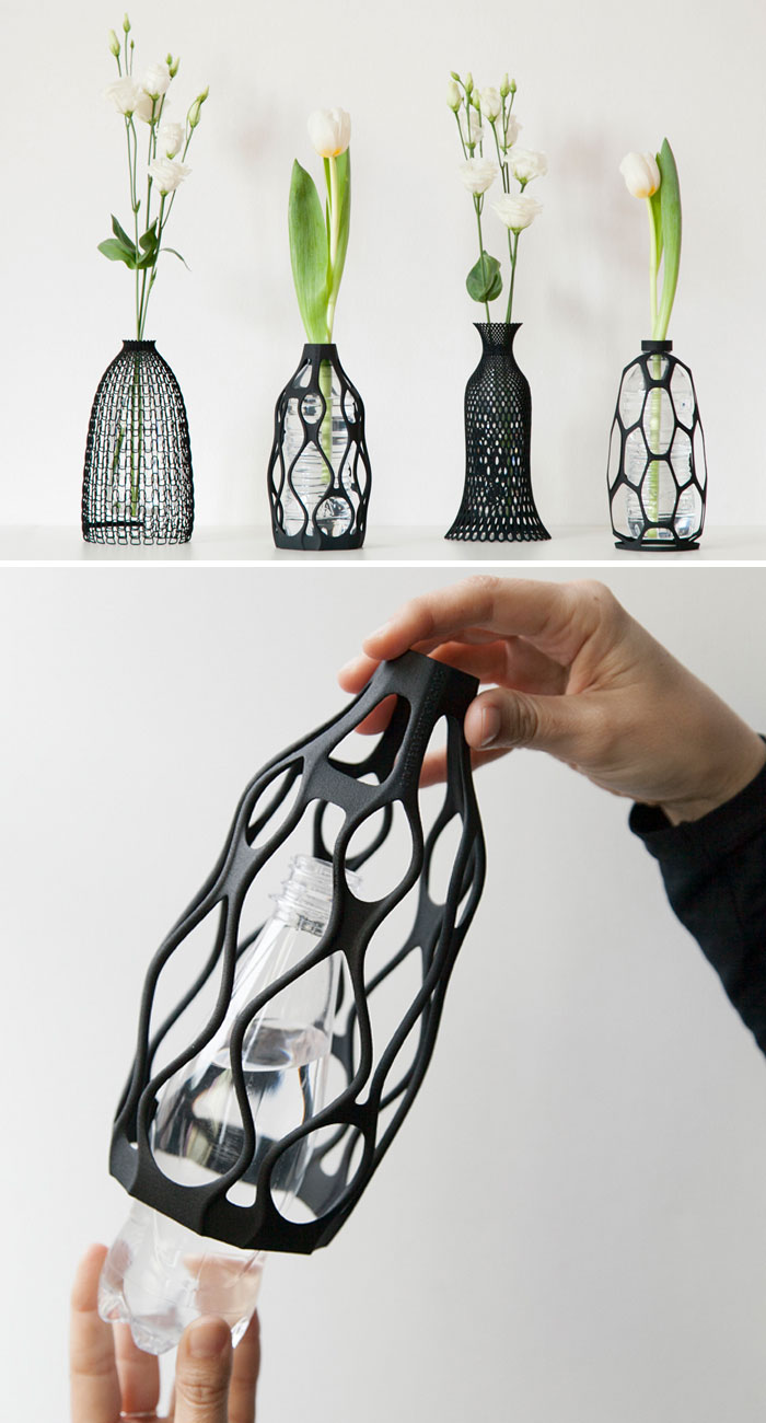 Hands fitting a 3D printer decorative black cage over a plastic bottle to reuse it as a vase.