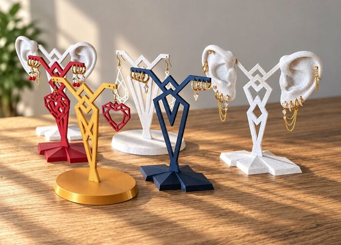 Artistic earring holder stands shaped like ears created using a 3D printer
