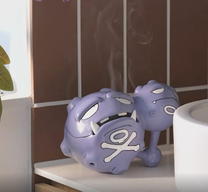 A purple Weezing-shaped incense burner emitting smoke, created with a 3D printer.