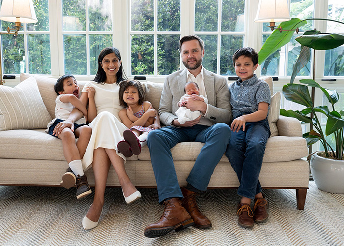 JD Vance and Second Lady Usha Vance sitting on a living room sofa with their three children JD Vance and Second Lady Usha Vance sitting on a living room sofa with their three children