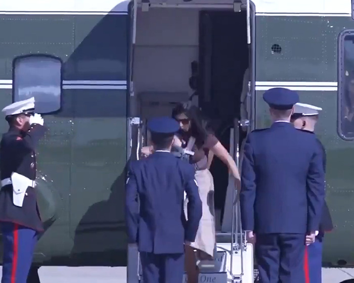 Second Lady Usha Vance descending helicopter stairs with a baby in a carrier. Second Lady Usha Vance descending helicopter stairs with a baby in a carrier.