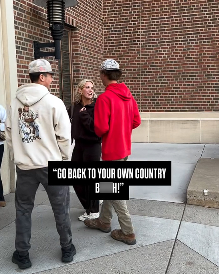 A group of students talking outside with overlaid text from a video telling a protester to go back to your country. A group of students talking outside with overlaid text from a video telling a protester to go back to your country.