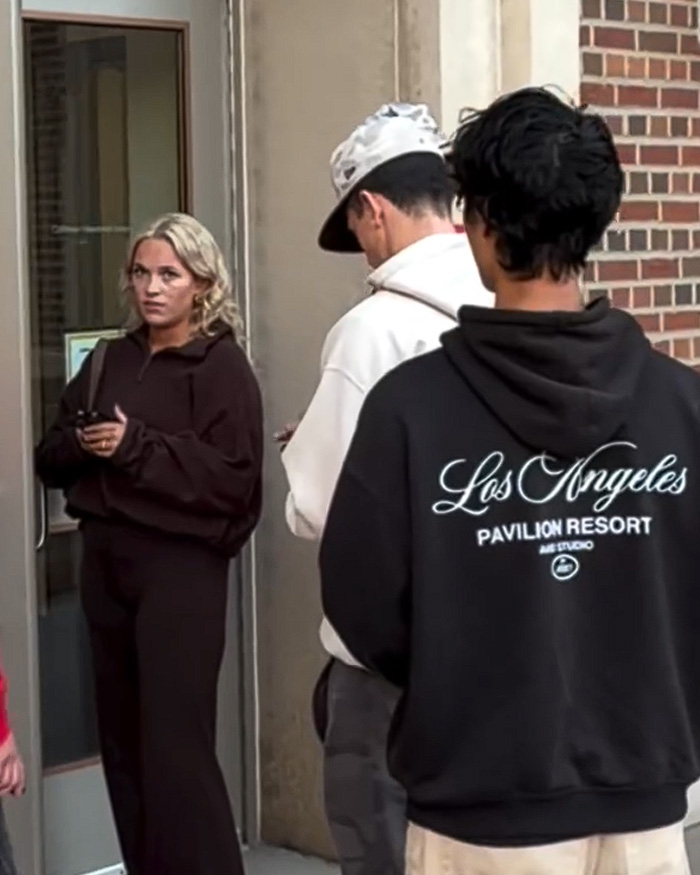 Students standing outside a campus building where a student told a protester to go back to your country. Students standing outside a campus building where a student told a protester to go back to your country.