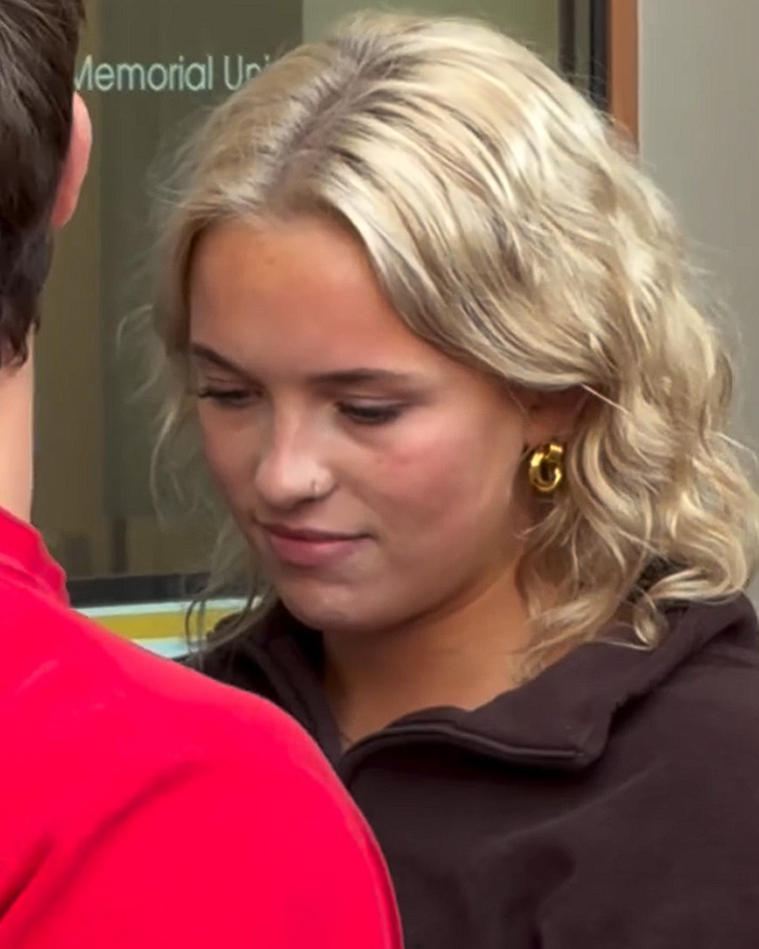 Close-up of a blonde student in a video telling a protester to go back to your country. Close-up of a blonde student in a video telling a protester to go back to your country.