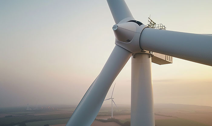 Close-up of wind turbine blades representing dangerous and high-paying wind turbine technician job