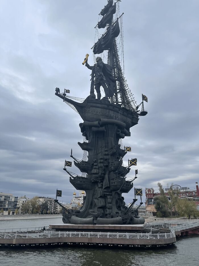 An imposing, dark Peter the Great monument on water, a grand yet controversial public art installation.