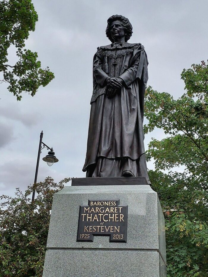 The statue of Margaret Thatcher on a stone plinth, an example of public art