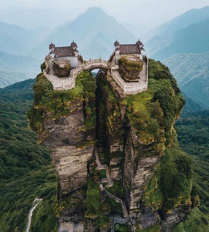 A cool and interesting view of two ancient Chinese temples perched on a steep twin peak mountain