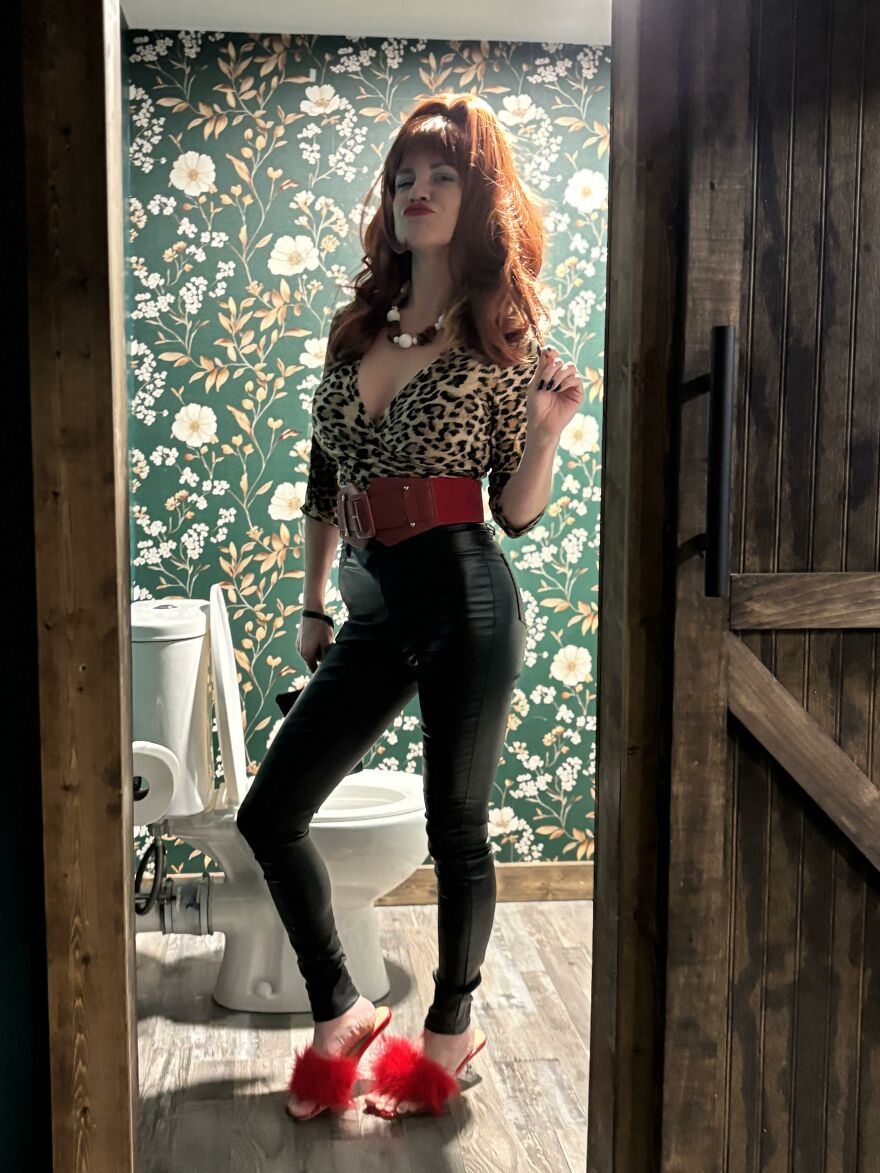 Woman posing in a chic leopard print top as part of creative Halloween costume ideas.