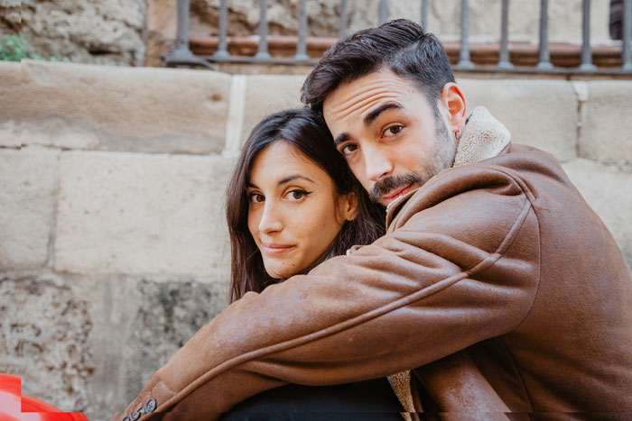 Couple embraces, showing relationship affected by man's dislike of cultural cuisine Couple embraces, showing relationship affected by man's dislike of cultural cuisine