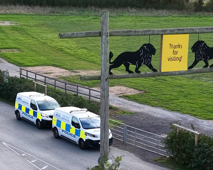 Police vans parked outside UK wildlife park near tiger enclosure entrance Police vans parked outside UK wildlife park near tiger enclosure entrance