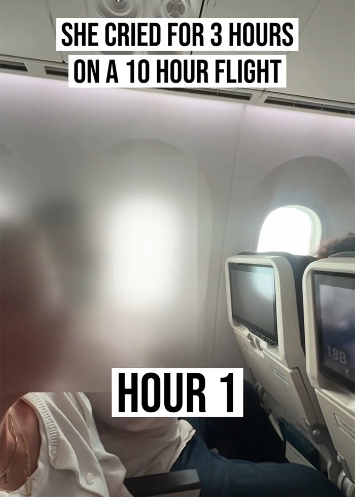Woman crying alone on a plane during long flight