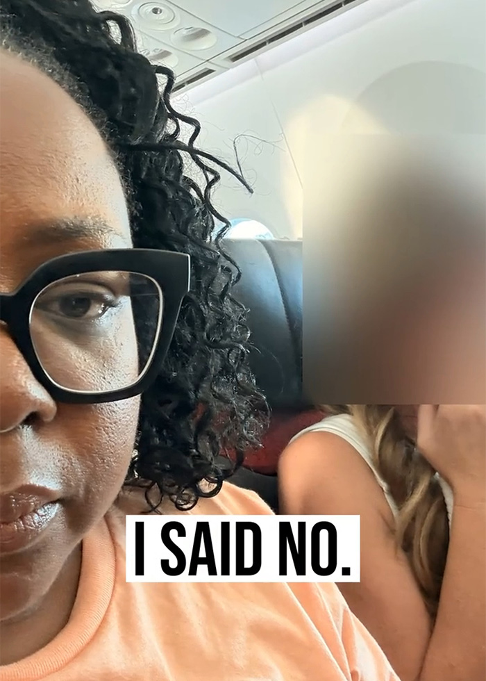 Woman on plane with glasses and text saying I said no