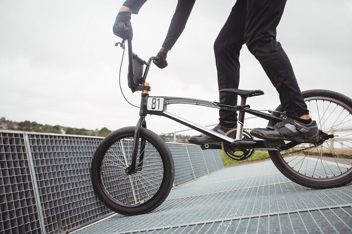 Cyclist performing a trick on a BMX bike, illustrating how quickly everything can fall apart with one wrong move.