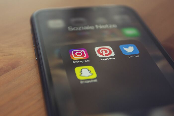 Smartphone displaying social media apps Instagram, Pinterest, Twitter and Snapchat close-up